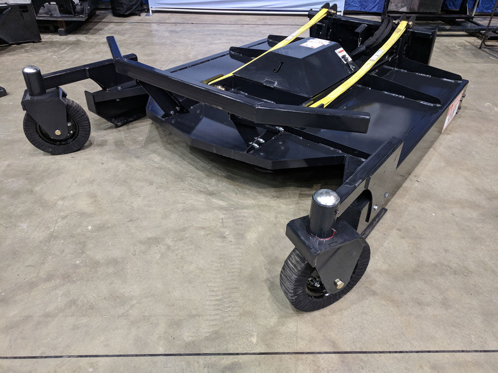 Jenkins Iron and Steel skid steer brush mower with adjustable gauge wheels shown at trade show